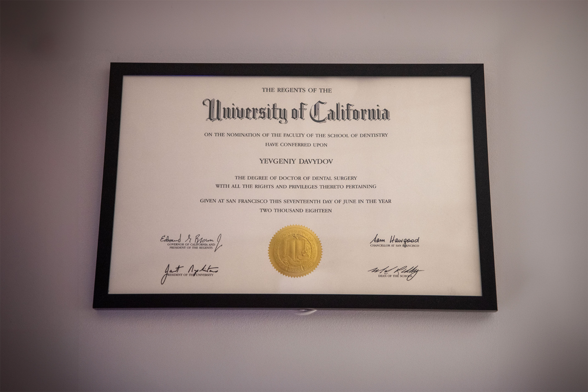 The image features a framed diploma with the text  UNIVERSITY OF CALIFORNIA  prominently displayed, indicating an educational achievement by an individual named Vincent Baywood.